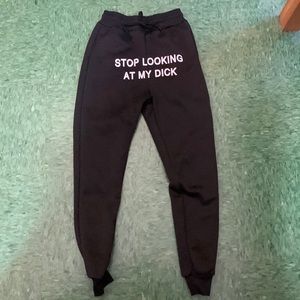 Black “stop looking at my d*ck” sweatpants.